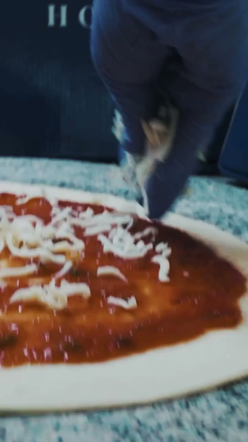A wood-fired pizza with mushrooms and cheese